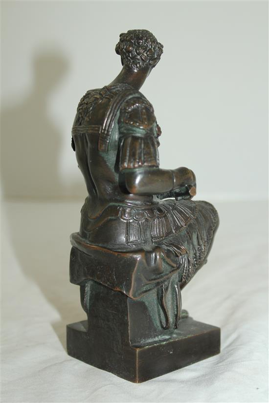 After the antique. A bronze model of a seated Roman soldier, inscribed Michel angelo, 6.5in, on separate marble plinth